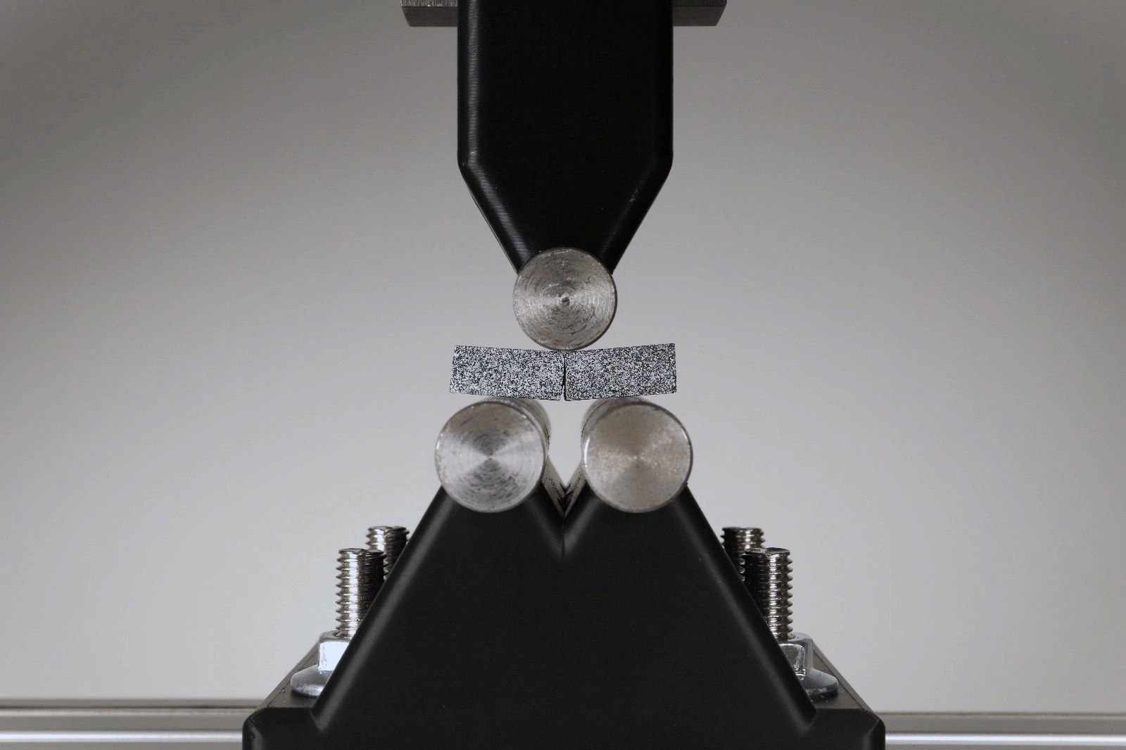 Tested concrete sample in three-point bending test